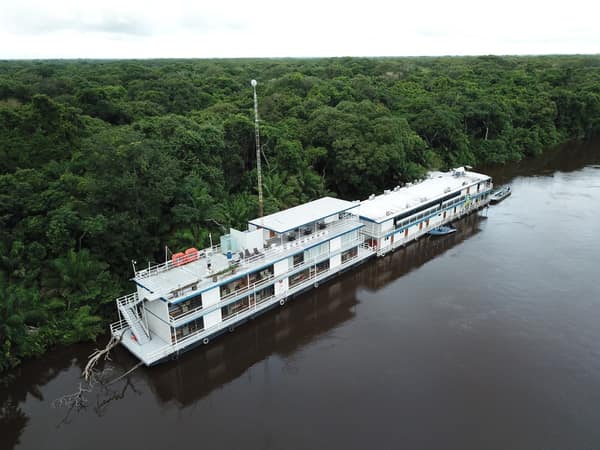 Aerial view of the SouthWild Flotel & Jaguar Suites moored on the river