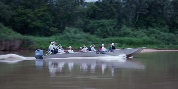 Guests on a jaguar safari boat outing