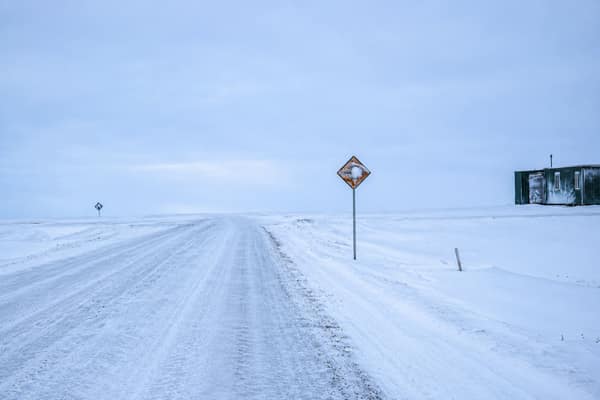 A snow-covered road into the village of Kaktovik