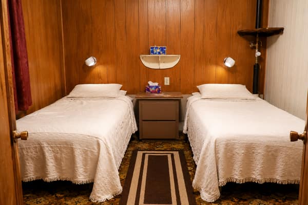 A guest room with a bed and washbasin at Waldo Arms
