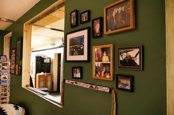 A framed-photo hallway inside the Waldo Arms lodge