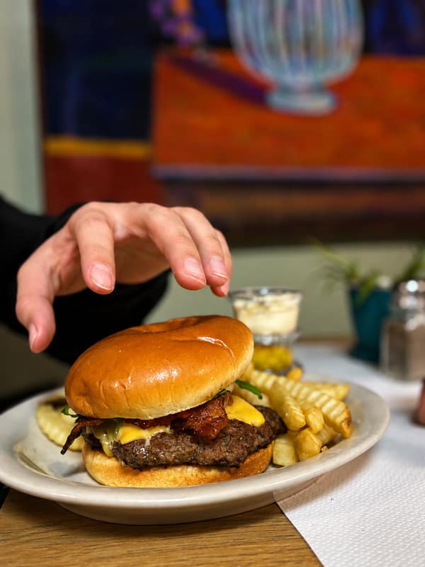 A burger and fries served at the Boneyard Bistro
