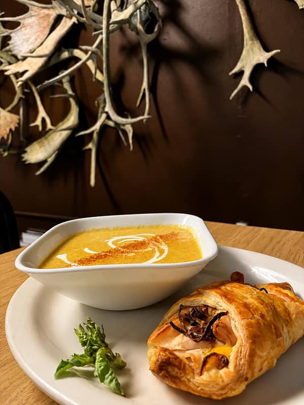 A baked pastry with dipping sauce at the Boneyard Bistro