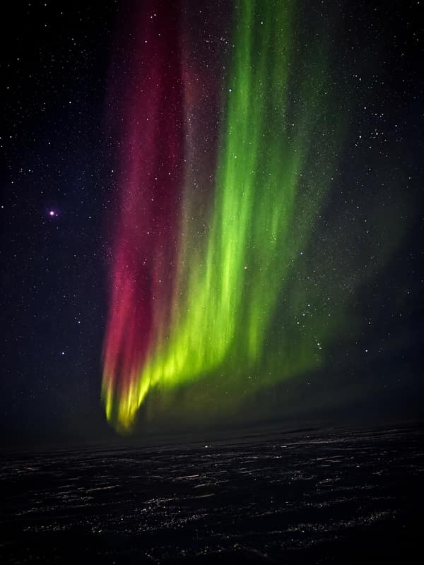 The aurora borealis over Kaktovik on the north coast of Alaska