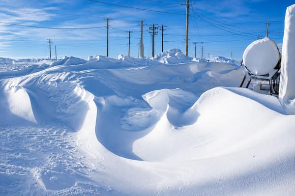 Snowdrifts and power lines through the village of Kaktovik in winter