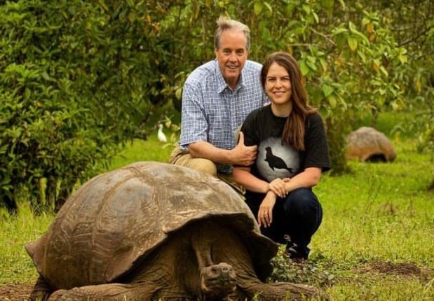 Dr. Charles Munn with a giant tortoise in the Galápagos