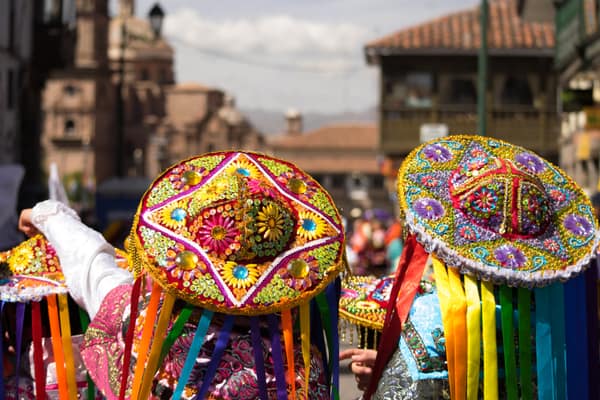 Dancers in colorful traditional dress at a Cusco festival