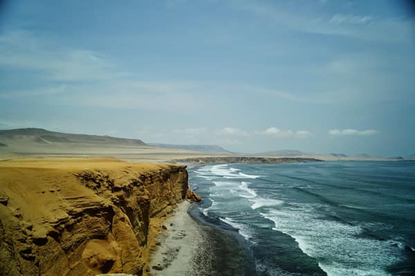 Desert cliffs meeting the ocean at Paracas