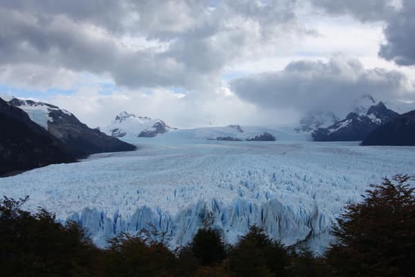 The Perito Moreno Glacier flowing between the mountains