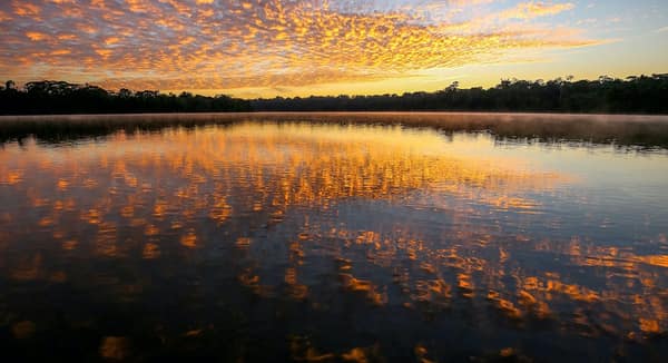 A golden sunset reflected on Sandoval Lake