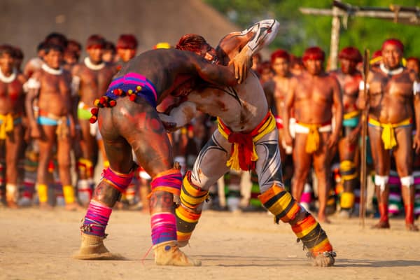Two wrestlers grappling in a Huka-Huka match