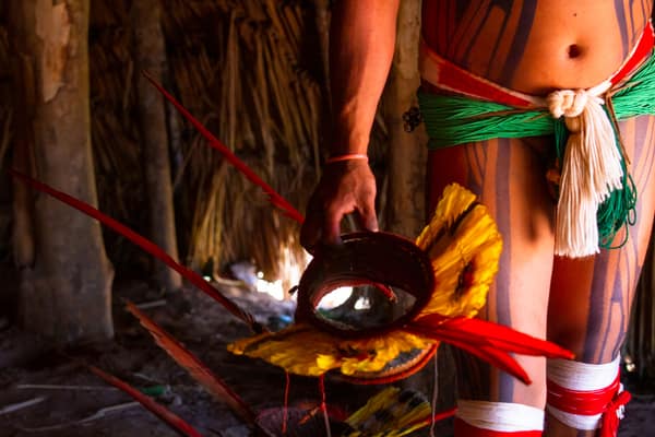 Preparing a feathered ceremonial headdress