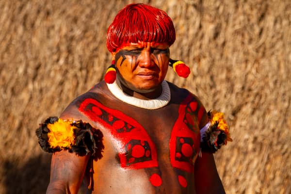 Portrait of a man in body paint and a shell necklace